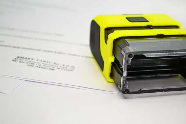 stamp, rubber stamp, documents, paperwork, stamp, stamp, stamp, stamp, stamp, rubber stamp. Handling Illinois paid leave and Washington PFML in an employee handbook template